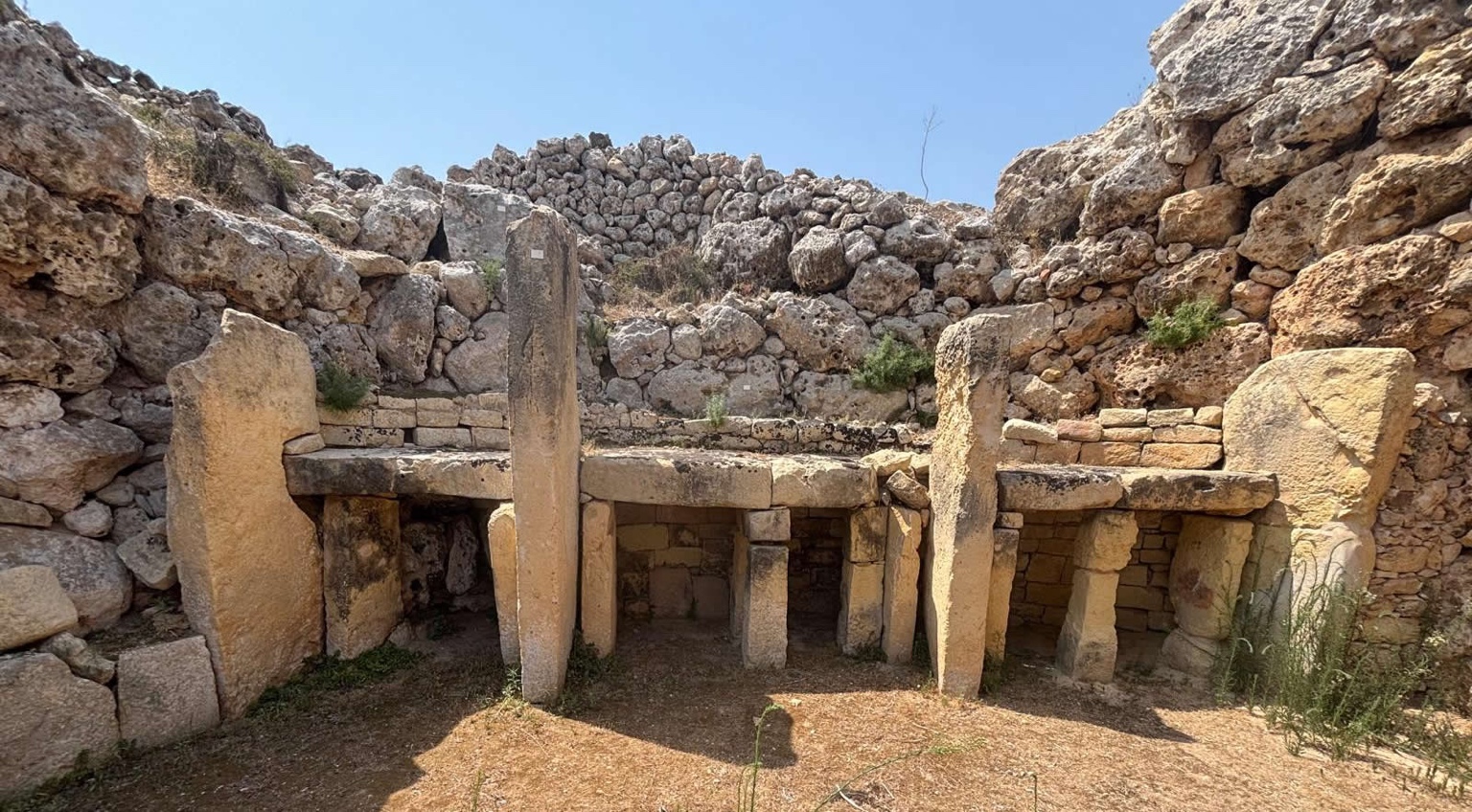 Interior remains of one of the Ġgantija Temples showing upright stones and trilithon structures